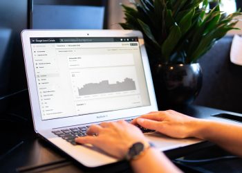 A person using Google Search Console on his laptop for better SEO of the website